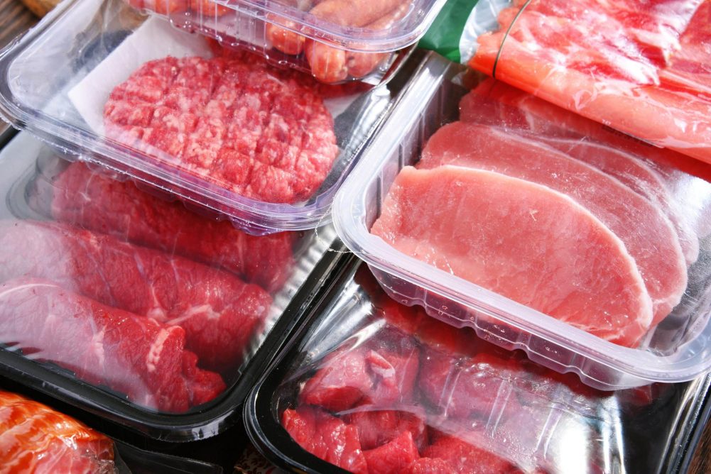 Composition with packages of assorted meat products