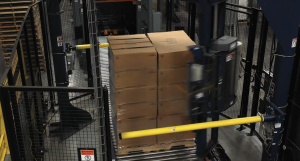 Automated, high-speed stretch wrapper to secure palletized boxes