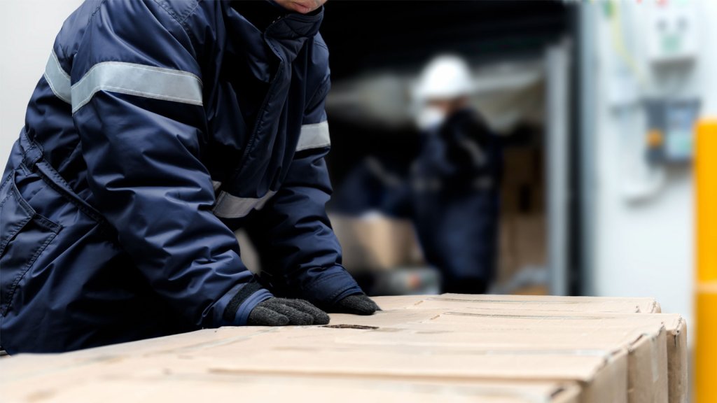 Operations staff in a temperature-controlled freezer handling boxes of inventory. Given the harsh conditions of cold storage, businesses are turning to KPI Solutions for systems integration of automated warehouse solutions such as ASRS, AGVs, AMRs, conveyance systems, and 4-way shuttle systems.