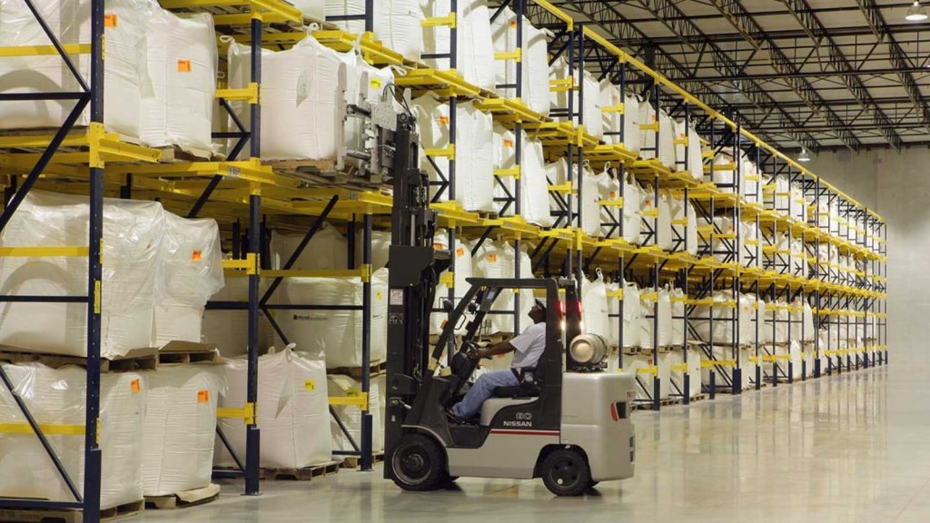 Forklift loading bulk, raw materials into pallet racking