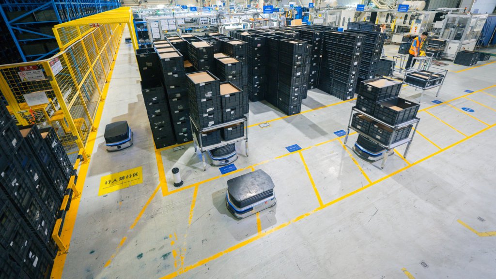Multiple Geekplus AMRs working in a warehouse environment