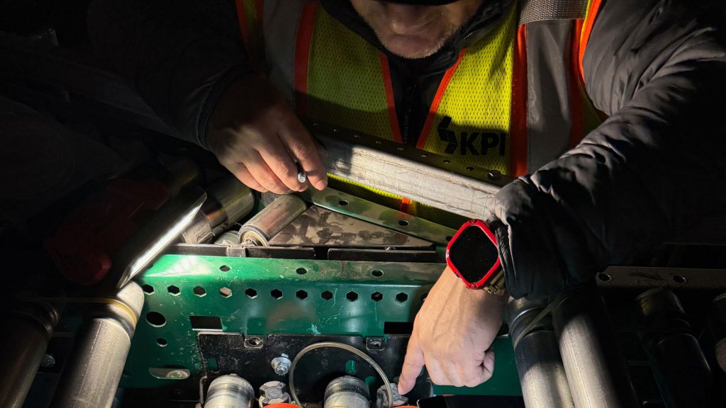 KPI Solutions LTS Technician examining machinery