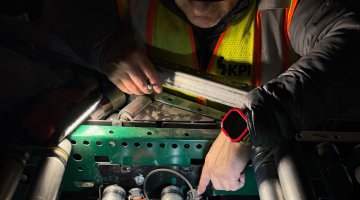 KPI Solutions LTS Technician examining machinery