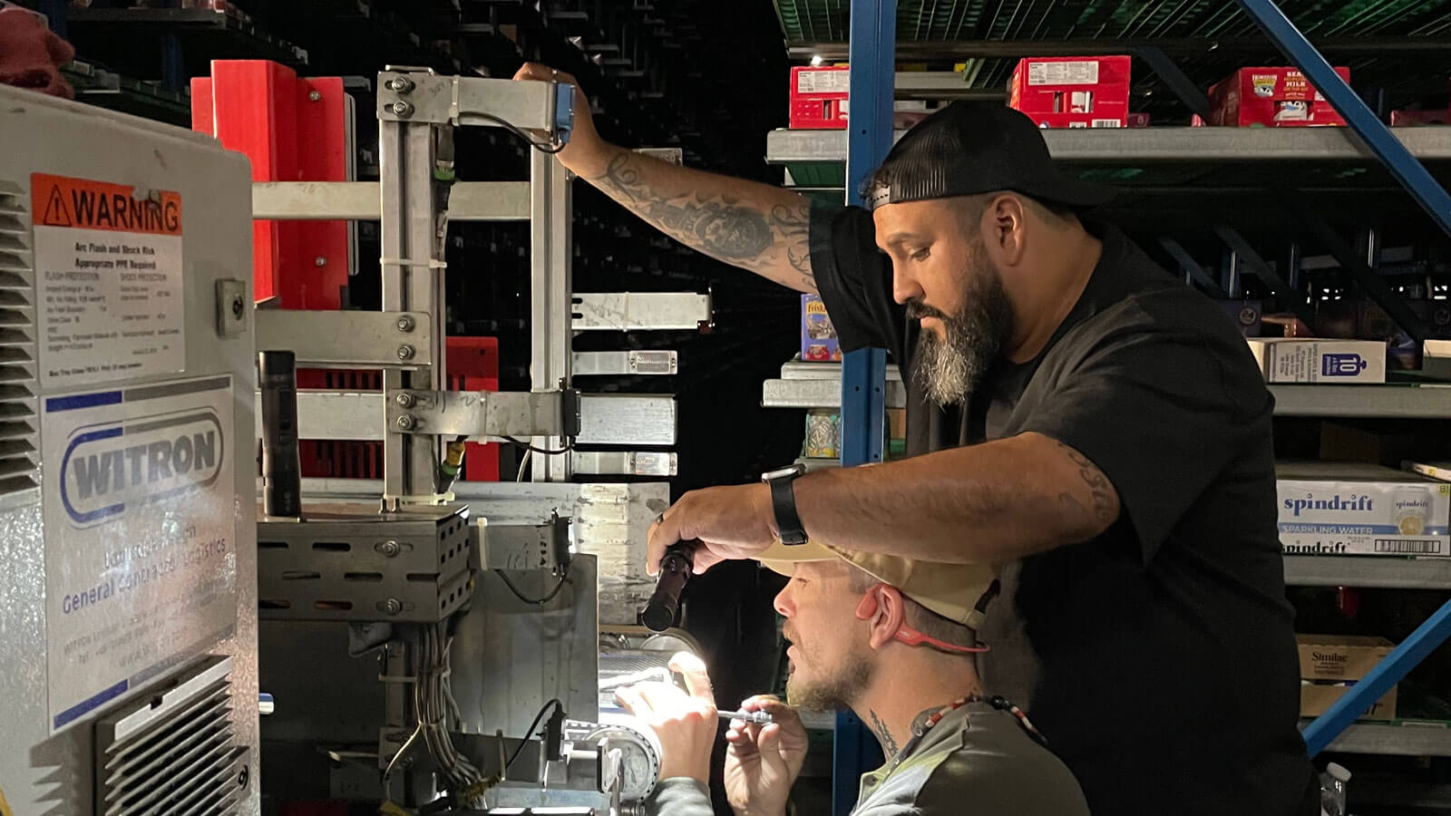 Two LTS technicians working on a job site