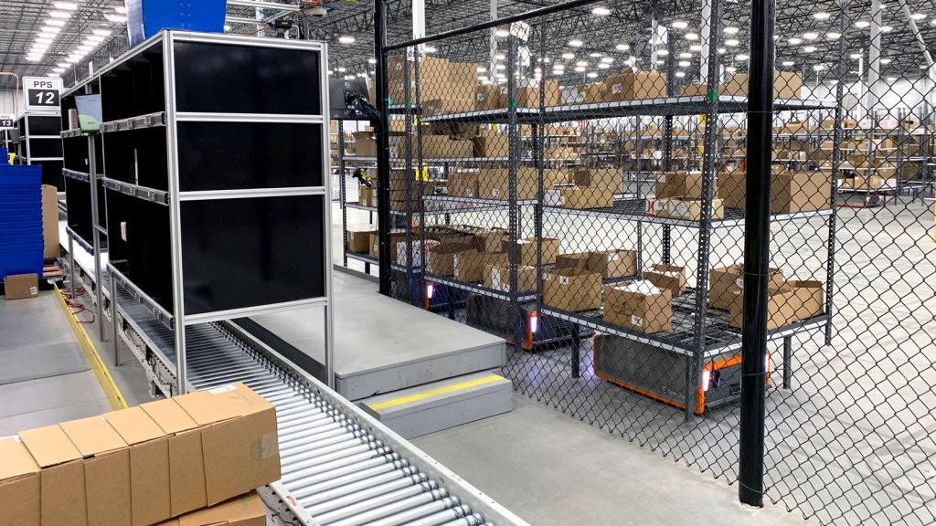 Trio of AMRs in Fenced Warehouse Environment