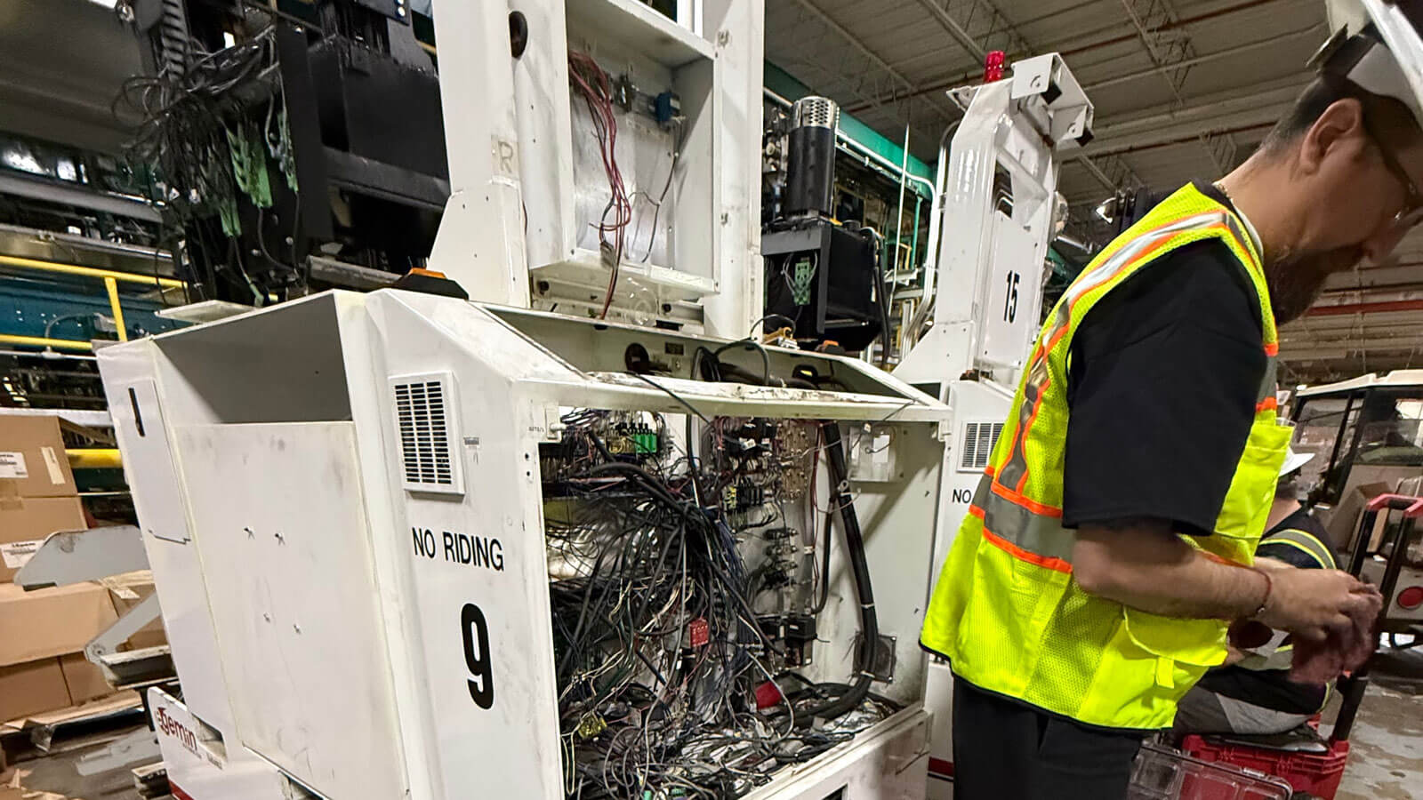 KPI LTS Technician Working on Machine