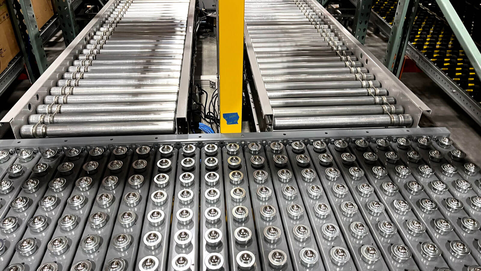 Pop-Up Wheel Sorter Next to Two Conveyors