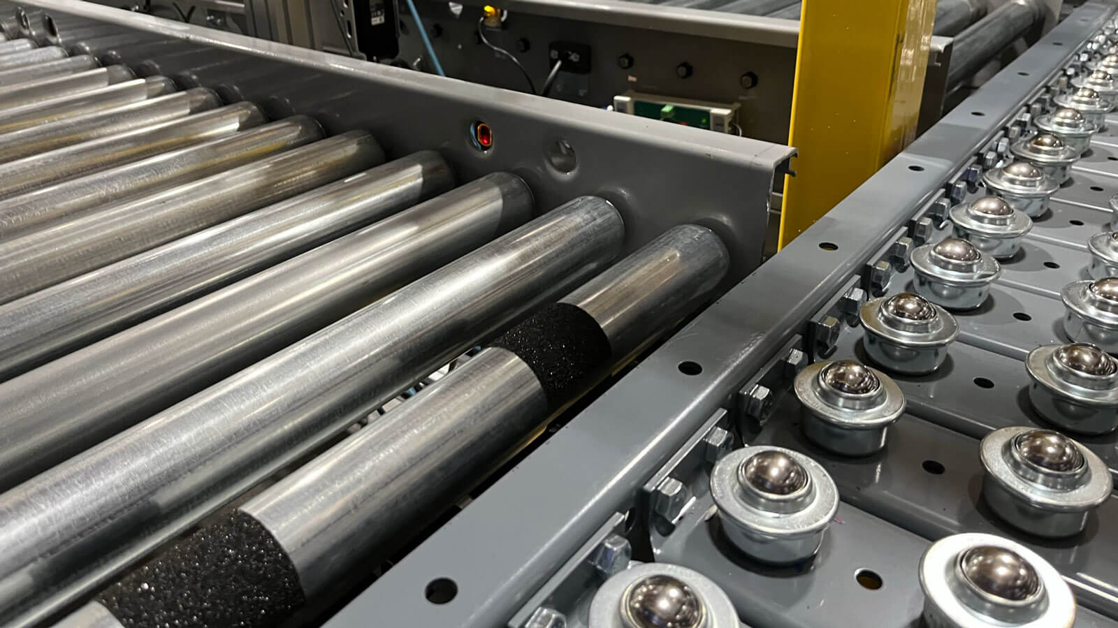 Pop-Up Wheel Sorter in Warehouse with Gravity Rollers