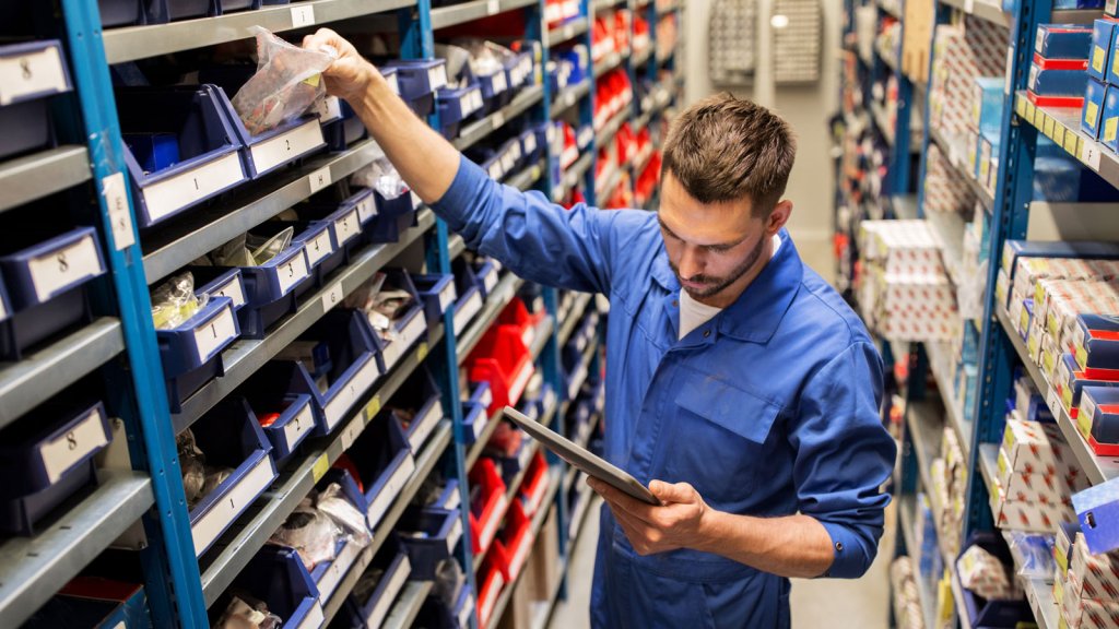 Maintenance worker locating spare warehouse parts